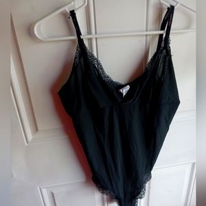 Ladies black Calvin Klein body suit slip, size L